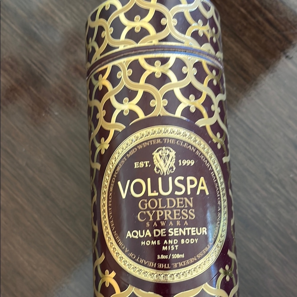 Voluspa Golden Cypress Aqua Candle with Black and Gold Design - Picture 2 of 3